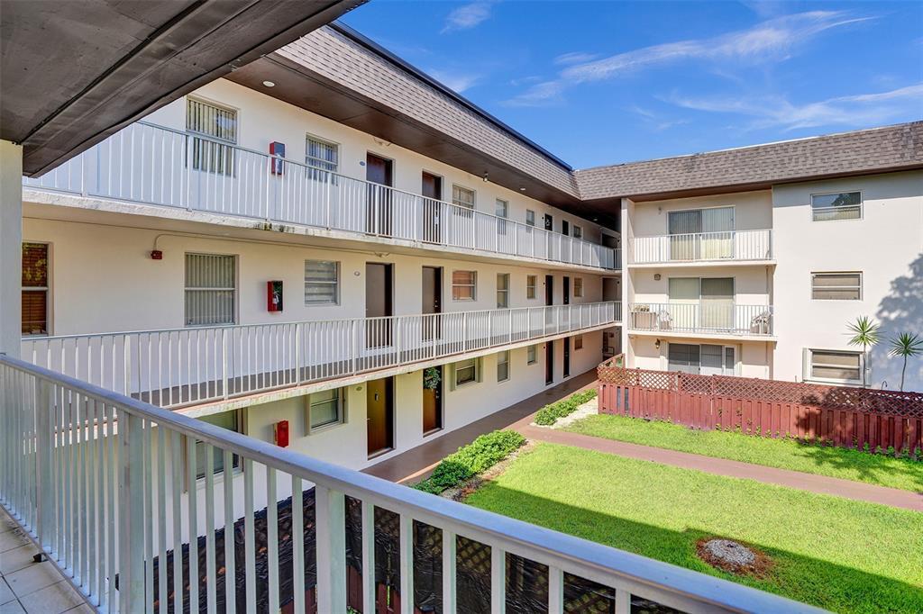 8601 Southwest 94th Street, Unit 201W Miami, FL 33156 - Photo 10 of 14 a balcony with an outdoor space