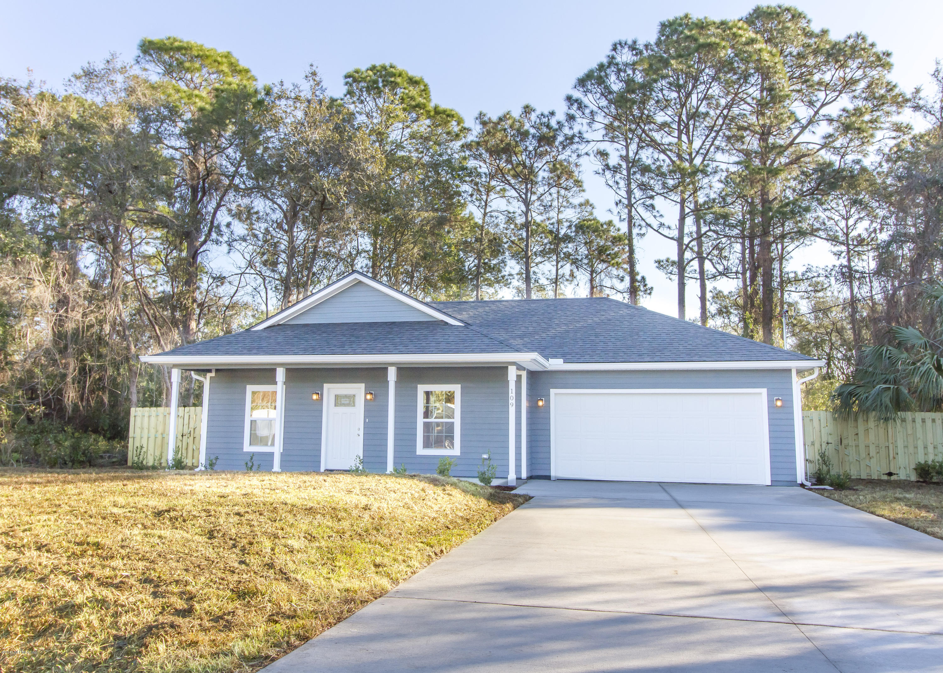 109 Jasmine Road St. Augustine, FL 32086 - Photo 1 of 36 a front view of a house with a garden