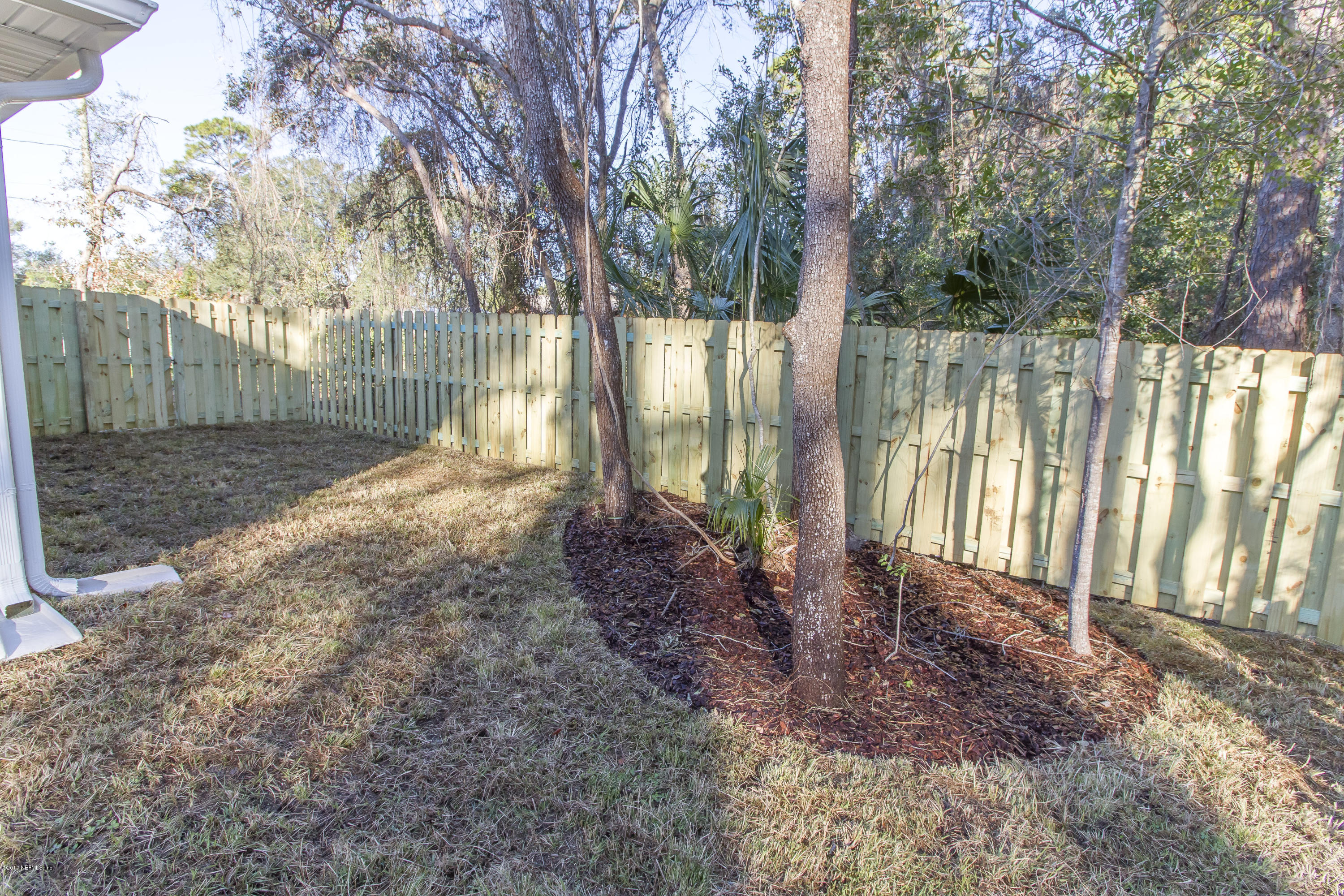 109 Jasmine Road St. Augustine, FL 32086 - Photo 18 of 36 a backyard of a house with lots of green space
