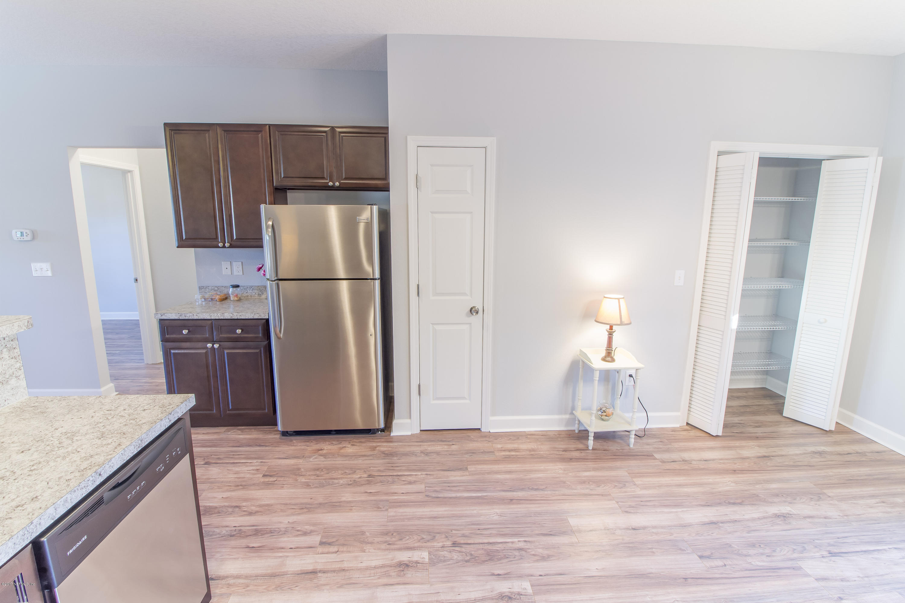 109 Jasmine Road St. Augustine, FL 32086 - Photo 23 of 36 a kitchen with a refrigerator a sink and a stove