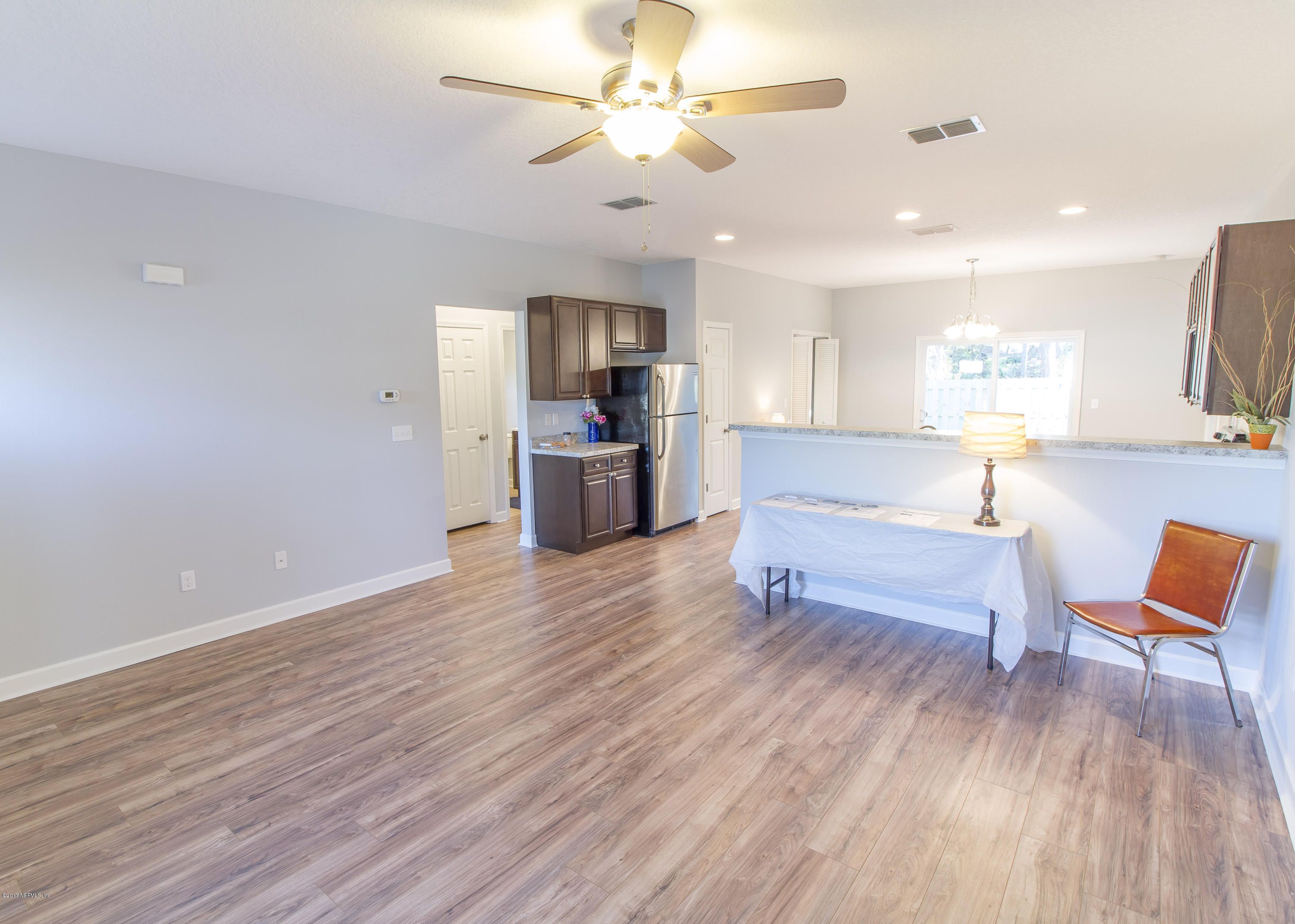 109 Jasmine Road St. Augustine, FL 32086 - Photo 5 of 36 a living room with furniture and a wooden floor