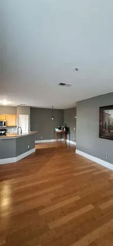 a view of a living room and kitchen