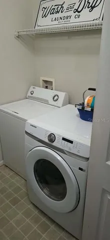 a utility room with dryer and washer