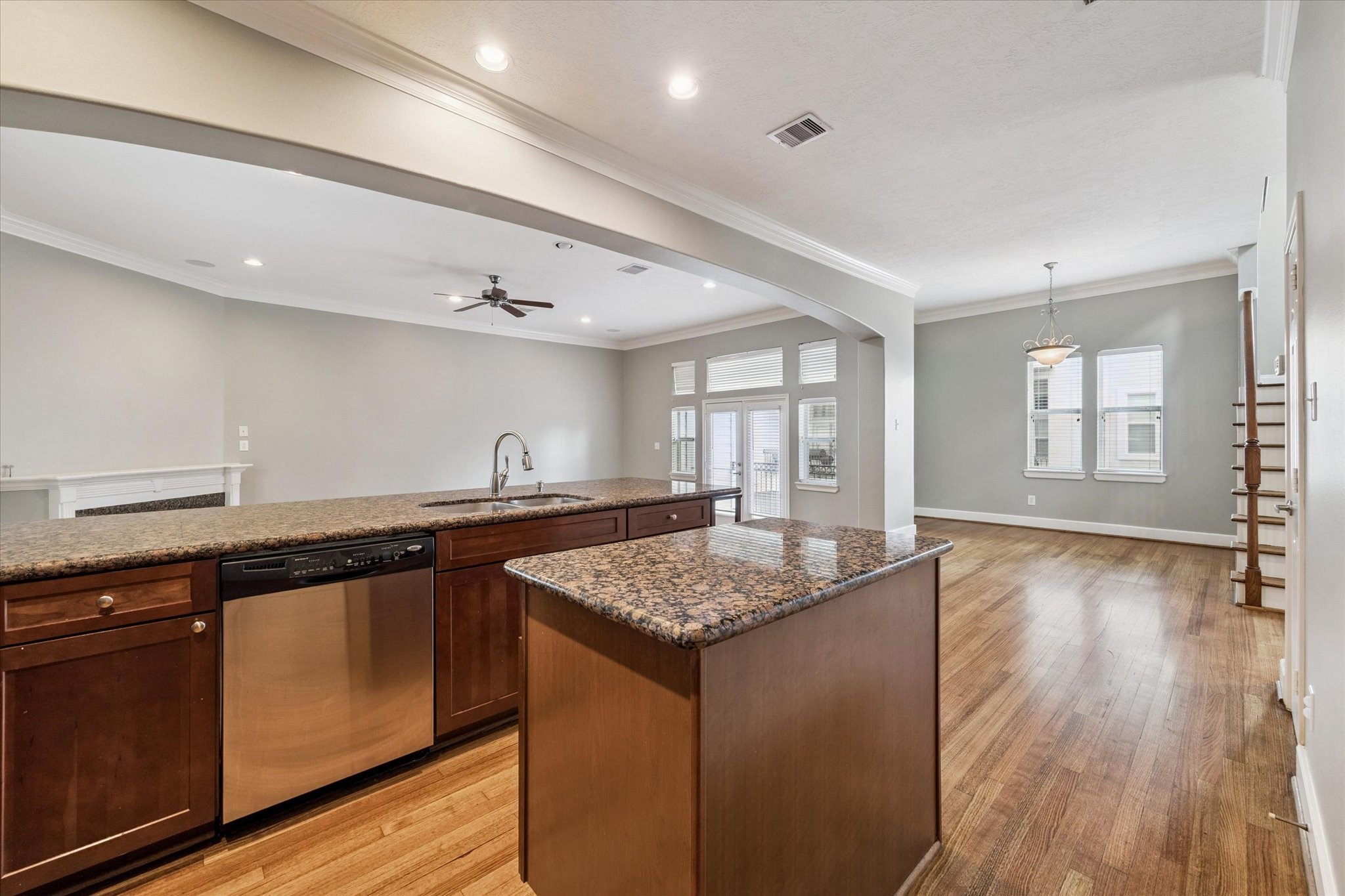5736 Kansas Street, Unit B Houston, TX 77007 - Photo 14 of 28 a kitchen with stainless steel appliances granite countertop a sink stove and wooden floor
