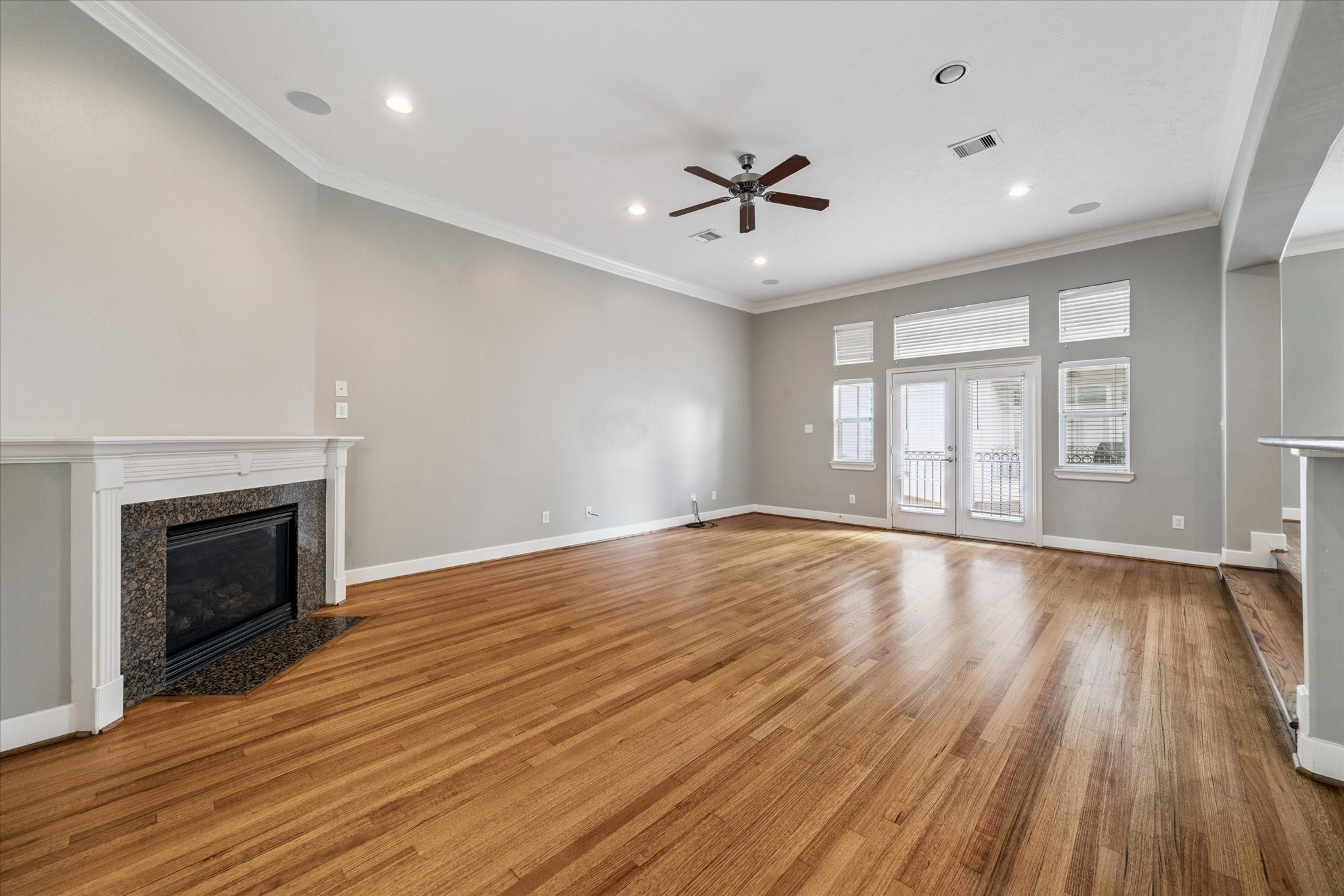 5736 Kansas Street, Unit B Houston, TX 77007 - Photo 16 of 28 a view of an empty room with wooden floor and a window