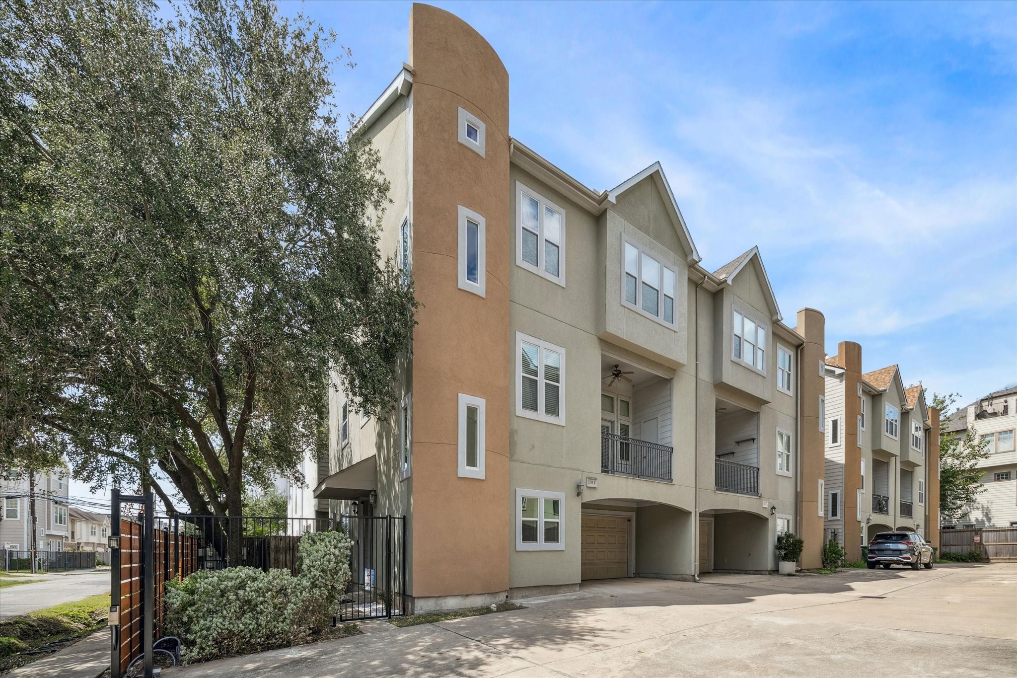 5736 Kansas Street, Unit B Houston, TX 77007 - Photo 2 of 28 a front view of a building with a garden