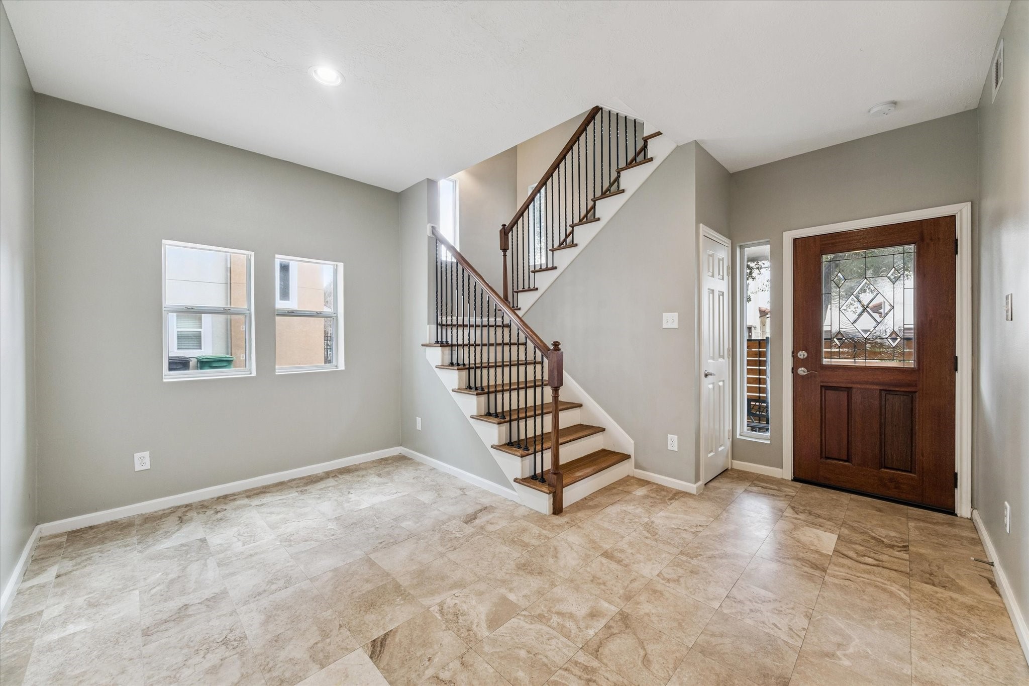 5736 Kansas Street, Unit B Houston, TX 77007 - Photo 6 of 28 a view of an entryway with wooden floor and stairs