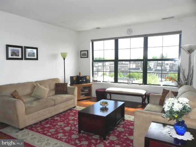 a living room with furniture and a large window