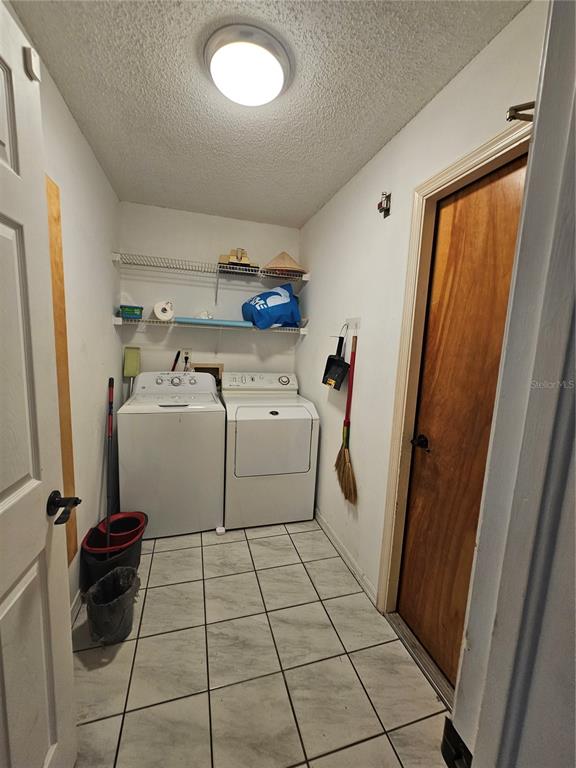 1885 Feather Tree Circle Clearwater, FL 33765 - Photo 18 of 18 a utility room with dryer and washer