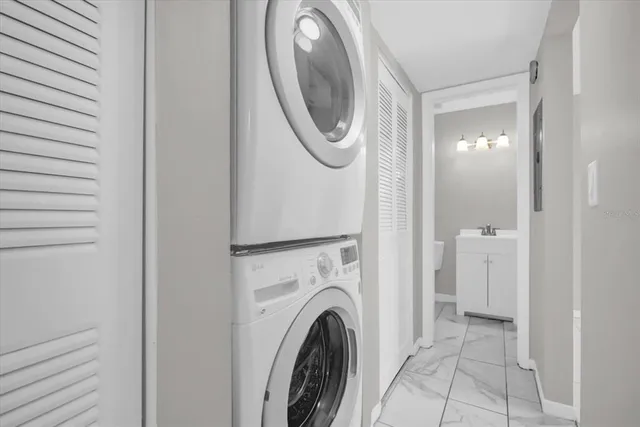 a view of a hallway with washer and dryer