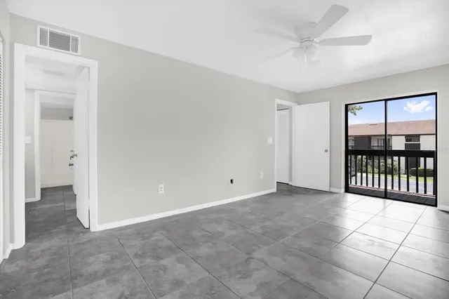 a view of an empty room with a window