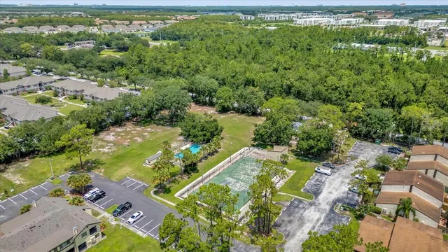 an aerial view of residential houses with outdoor space