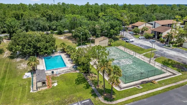 an aerial view of residential houses with outdoor space and street view