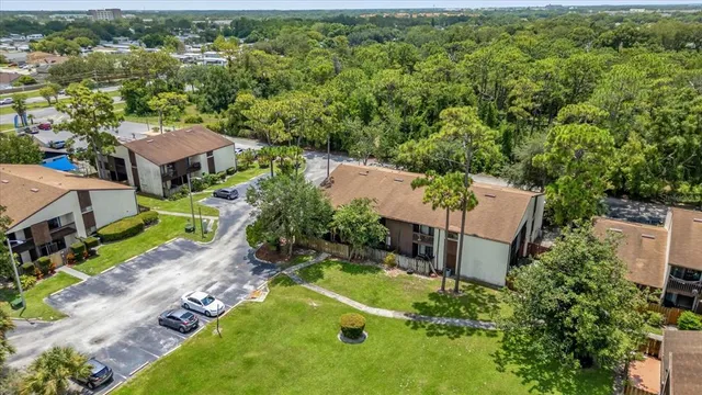 an aerial view of a house with yard swimming pool and outdoor seating