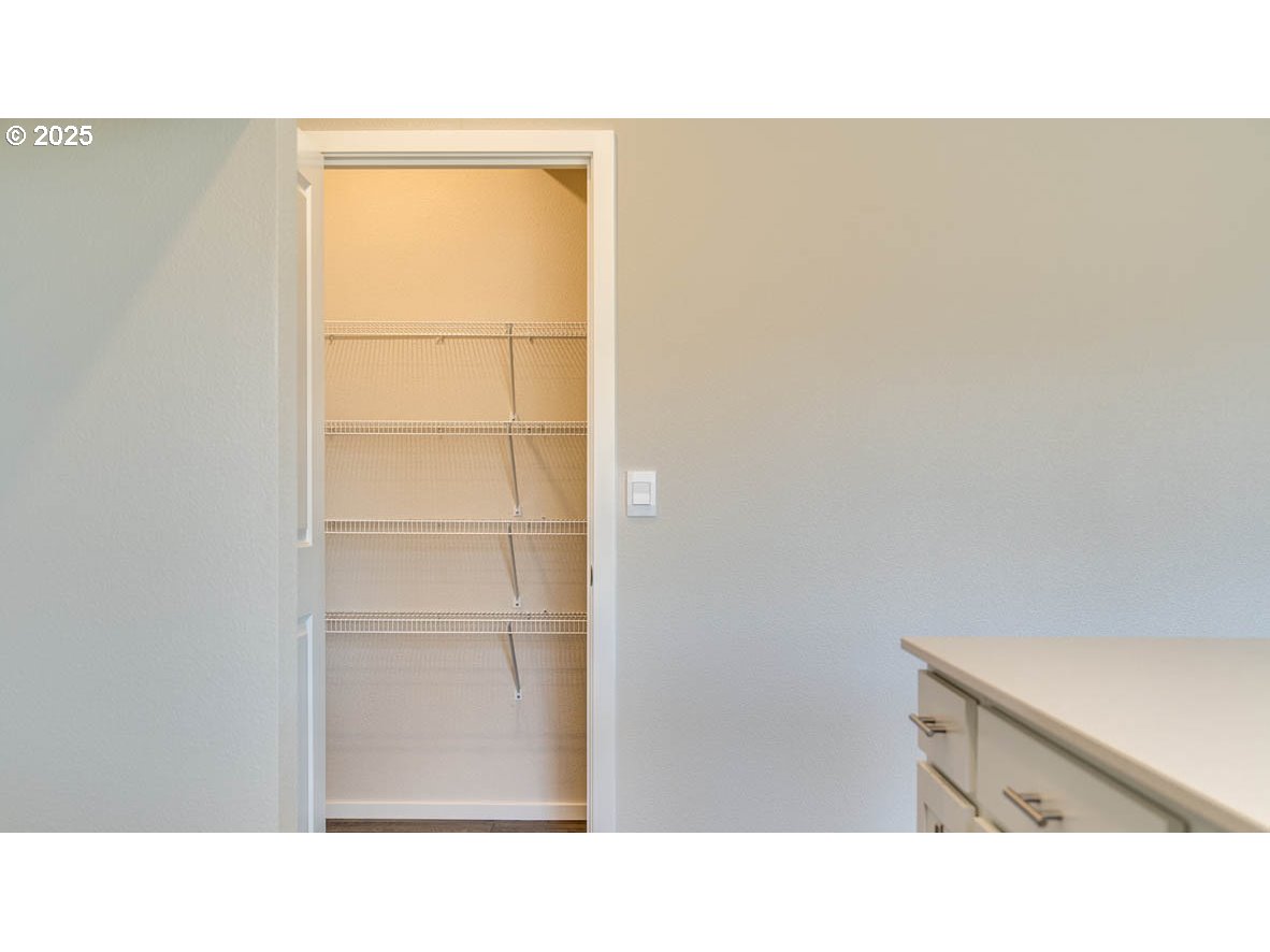 2957 U Street Springfield, OR 97477 - Photo 7 of 22 a open space with a cabinet and mirror