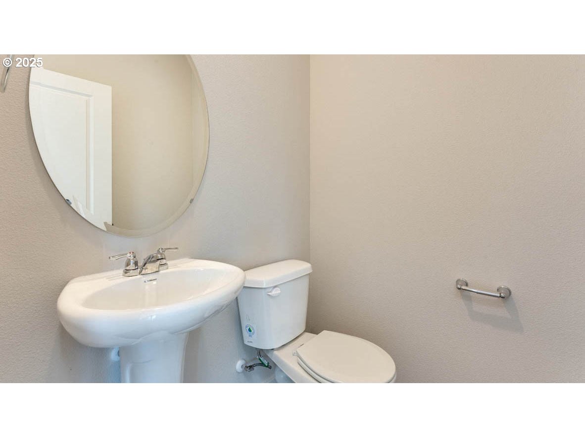 2957 U Street Springfield, OR 97477 - Photo 10 of 22 a bathroom with a sink toilet and a mirror