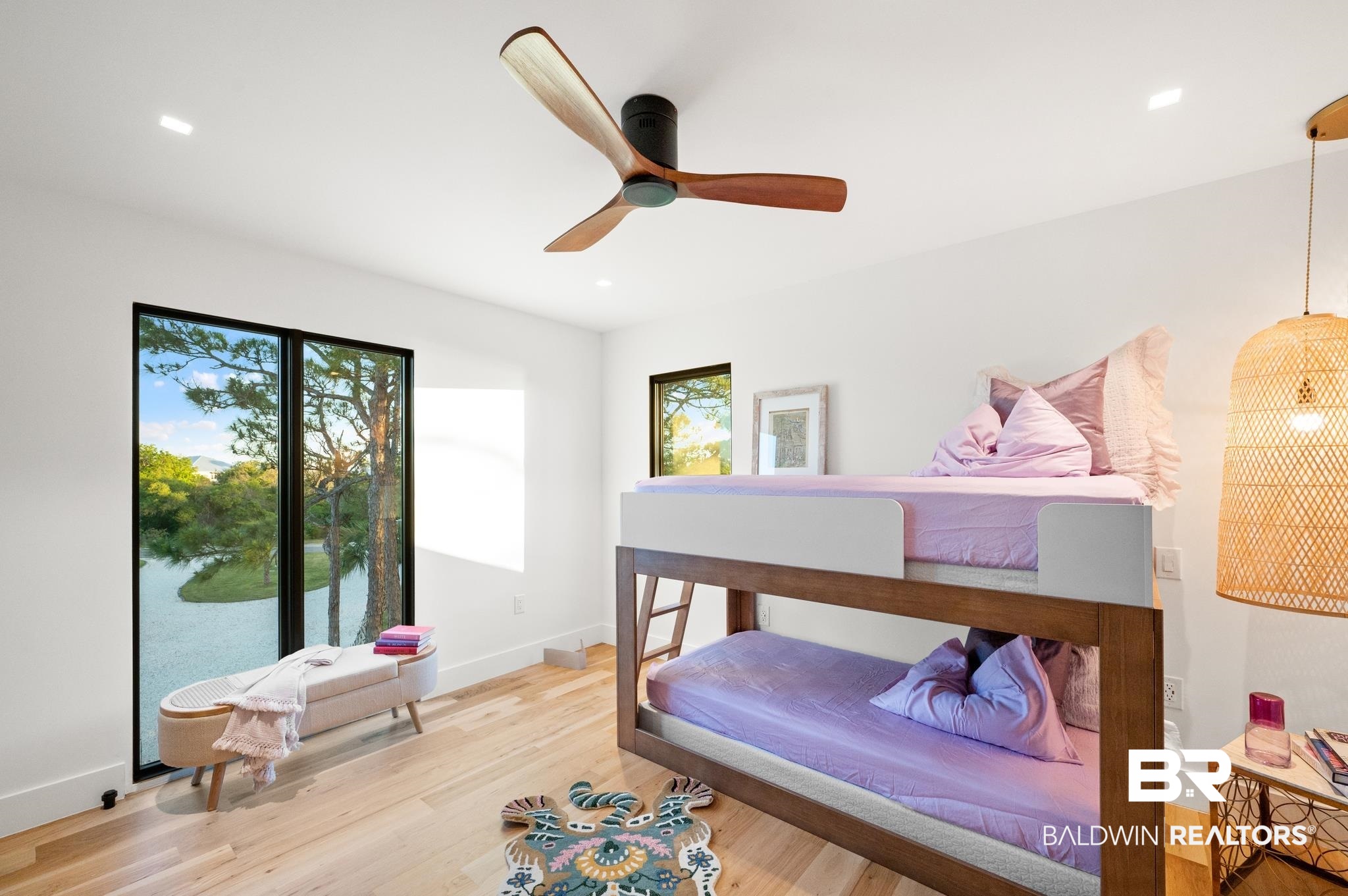 33349 River Road Orange Beach, AL 36561 - Photo 25 of 61 Expansive window offering a water view, complemented by light wood-finish flooring, recessed lighting, a modern ceiling fan, and a woven pendant light fixture