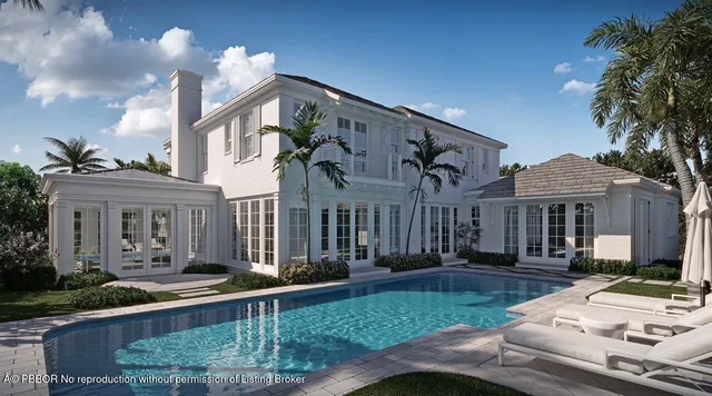 a view of a house with a patio and a yard