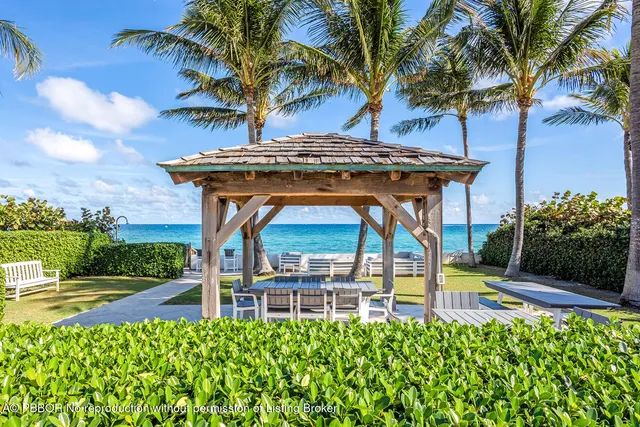 a view of a chair and table in the garden