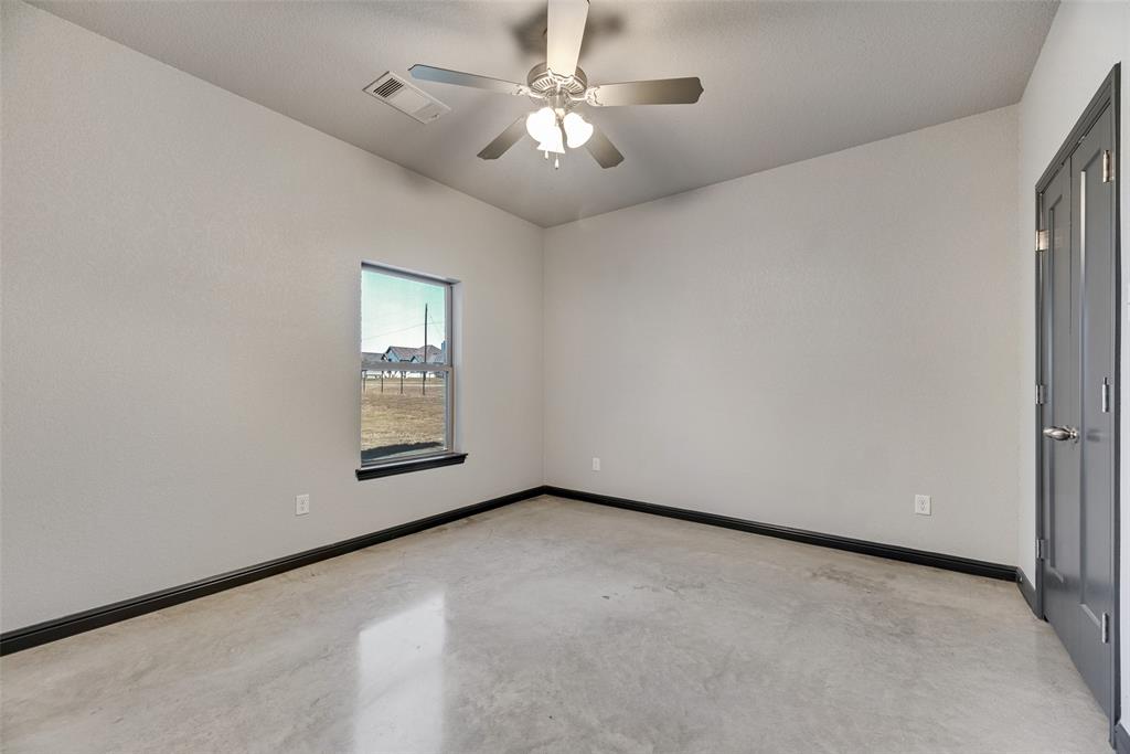 416 Christian Way Azle, TX 76020 - Photo 14 of 23 Bedroom #3 featuring concrete flooring and ceiling fan