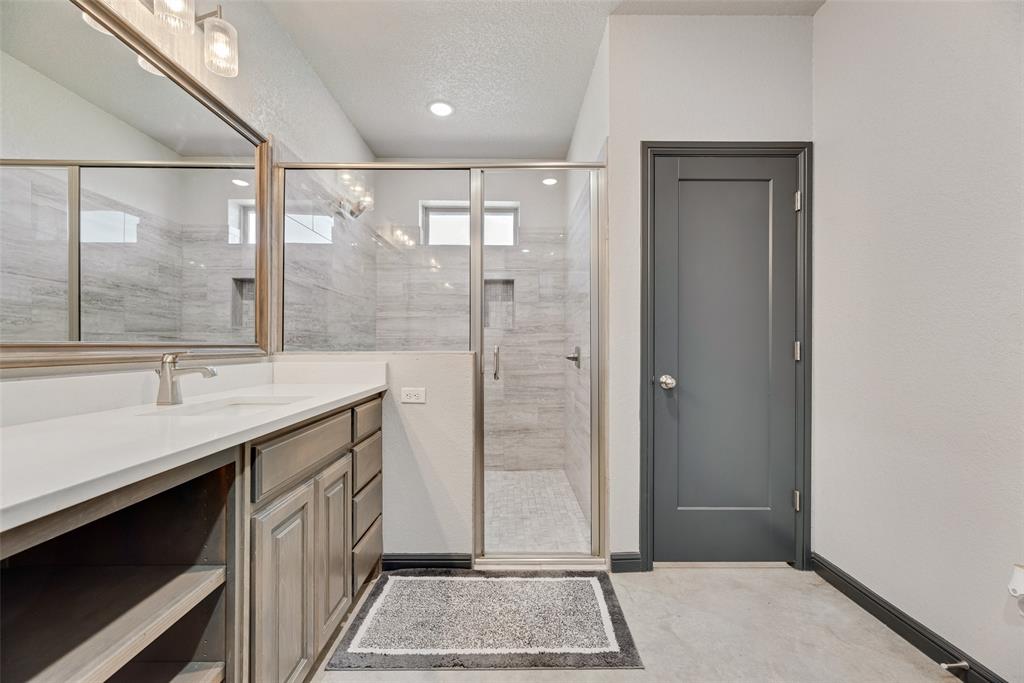 416 Christian Way Azle, TX 76020 - Photo 16 of 23 Primary bathroom featuring double vanity and oversized shower