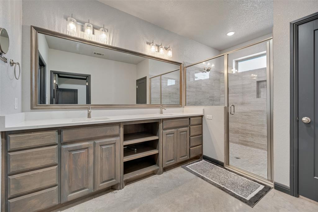 416 Christian Way Azle, TX 76020 - Photo 17 of 23 Primary bathroom featuring double vanity and oversized shower