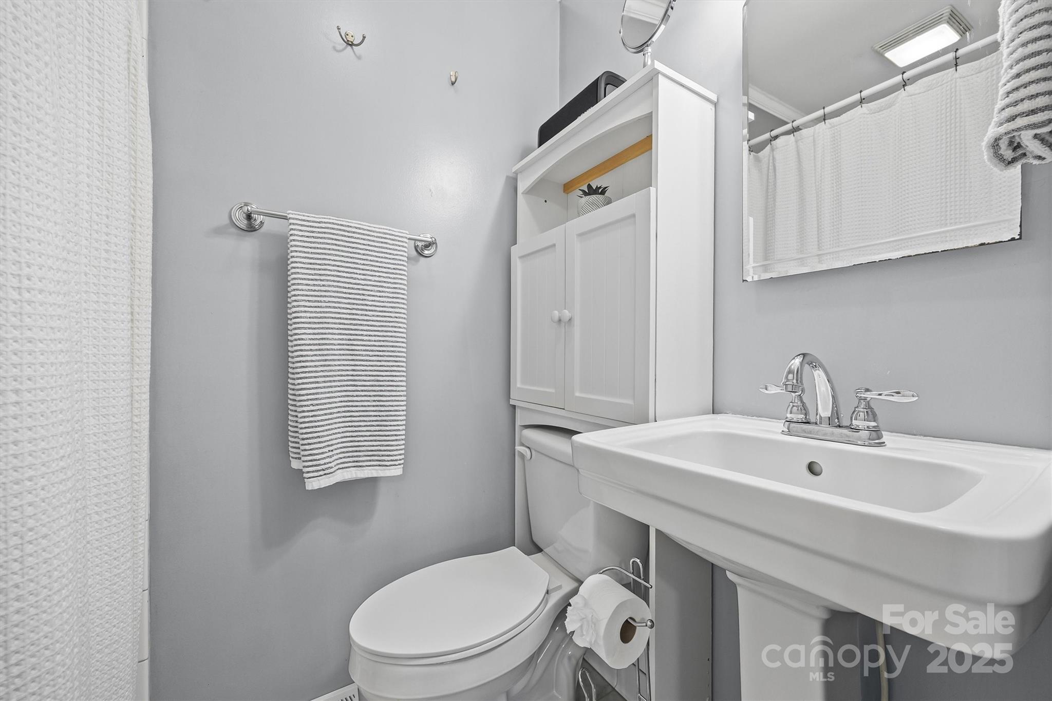 110 Glover Road Gastonia, NC 28056 - Photo 19 of 30 a bathroom with a sink a toilet and shower