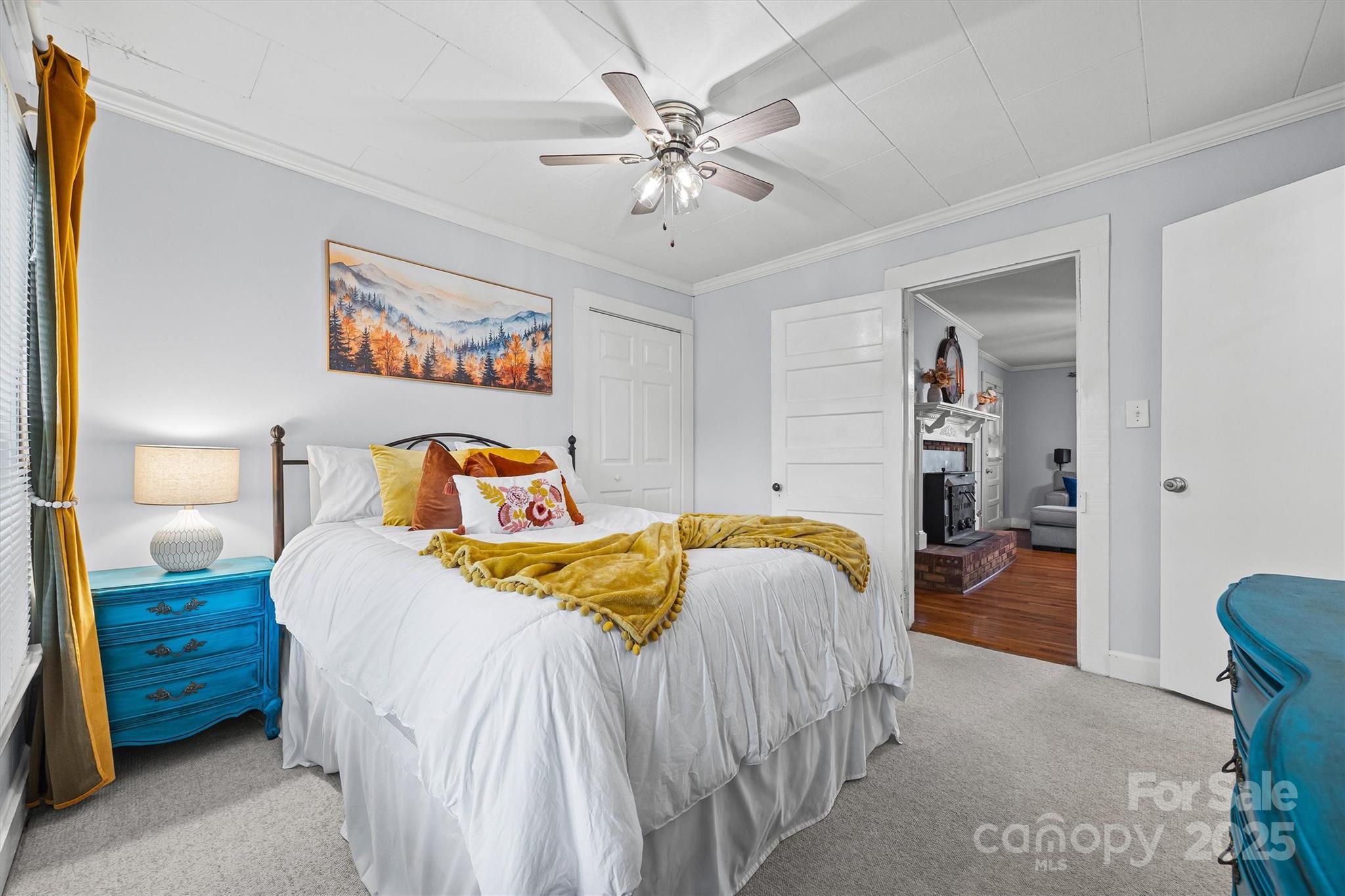 110 Glover Road Gastonia, NC 28056 - Photo 21 of 30 a bedroom with a bed and a chandelier