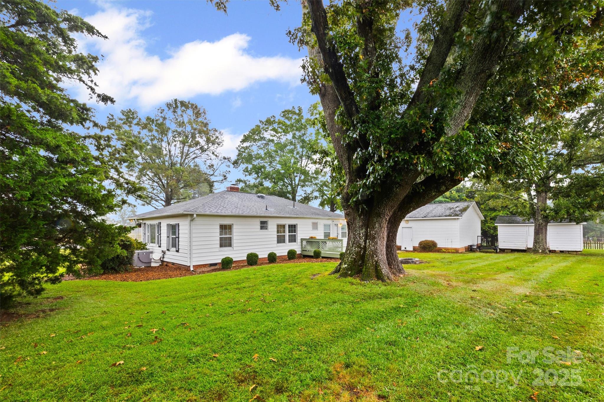 110 Glover Road Gastonia, NC 28056 - Photo 25 of 30 a view of house with a big yard and large trees