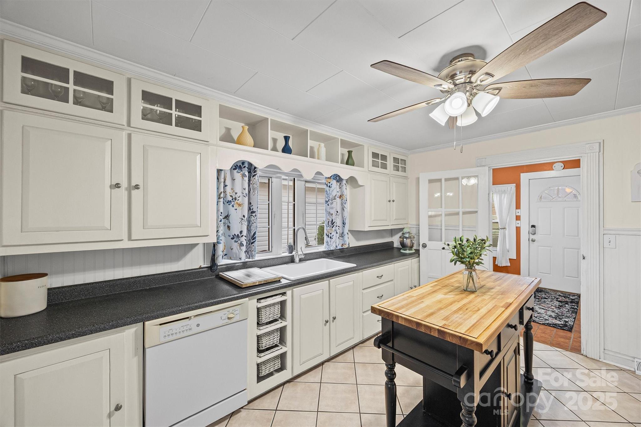 110 Glover Road Gastonia, NC 28056 - Photo 9 of 30 a kitchen with a table chairs window and cabinets