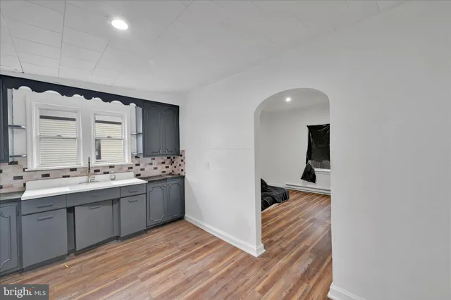 a kitchen with stainless steel appliances granite countertop a sink and cabinets