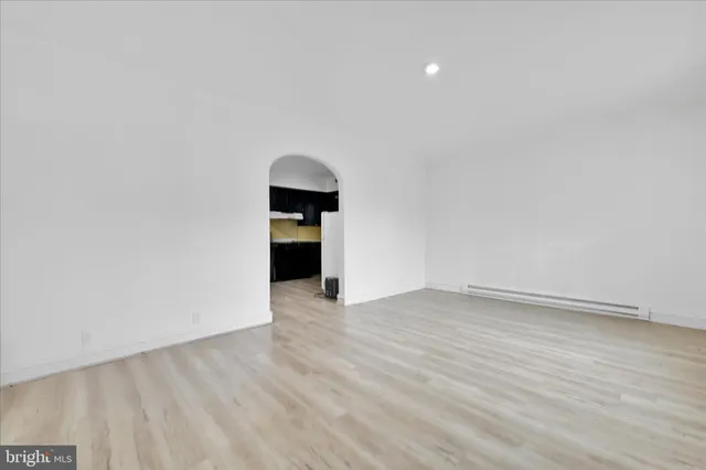 a view of an empty room with a sink