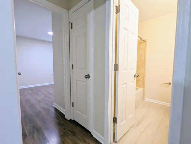 a view of a bathroom with a glass shower door