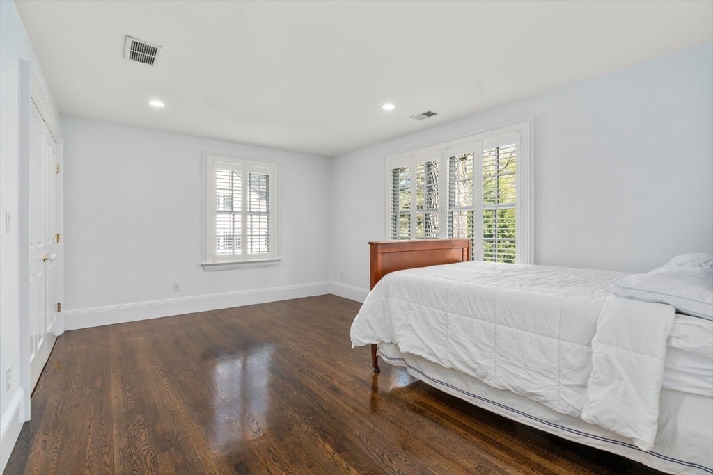 22 Plymouth Road Wellesley, MA 02481 - Photo 29 of 37 a bedroom with a bed and a window