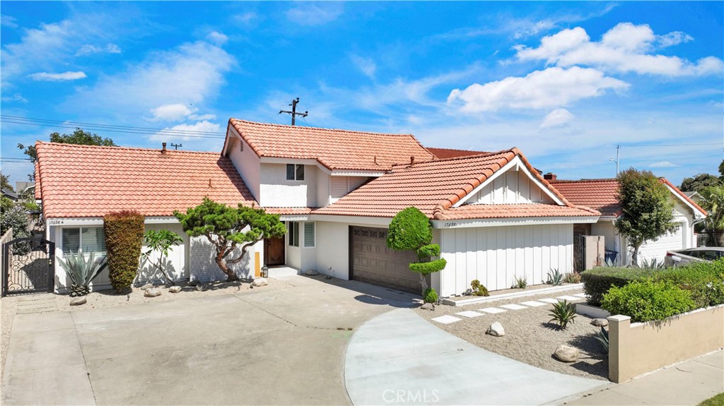 17698 Locust Street Fountain Valley, CA 92708 - Photo 1 of 1 a front view of a house with garden