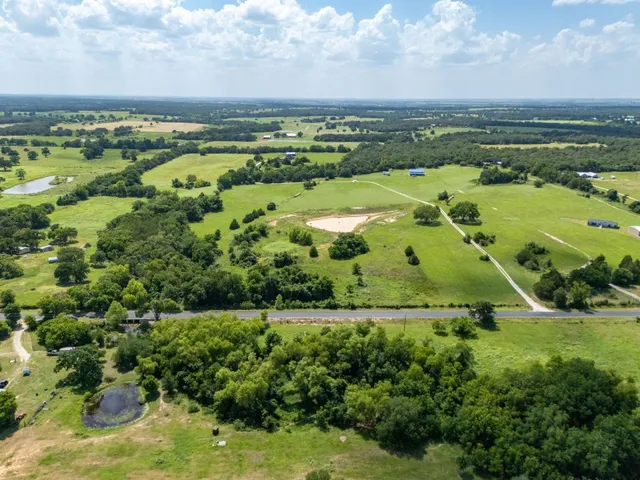 a view of a lake with a large yard
