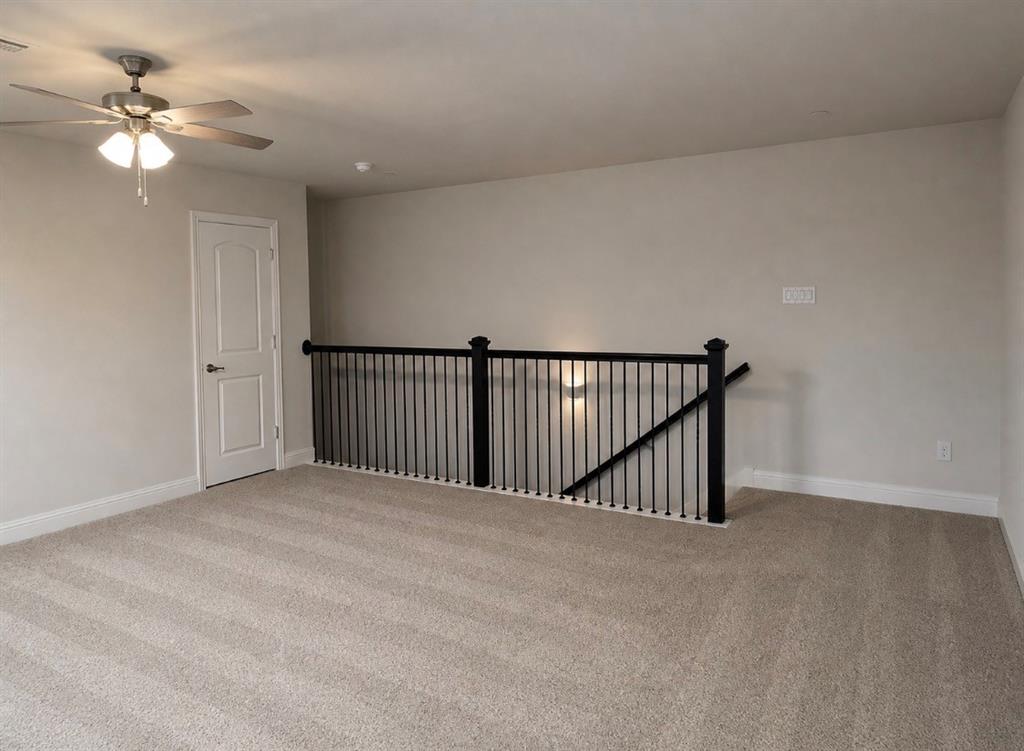 7849 Sunset Boulevard Rowlett, TX 75088 - Photo 12 of 13 a view of a livingroom with a ceiling fan and window