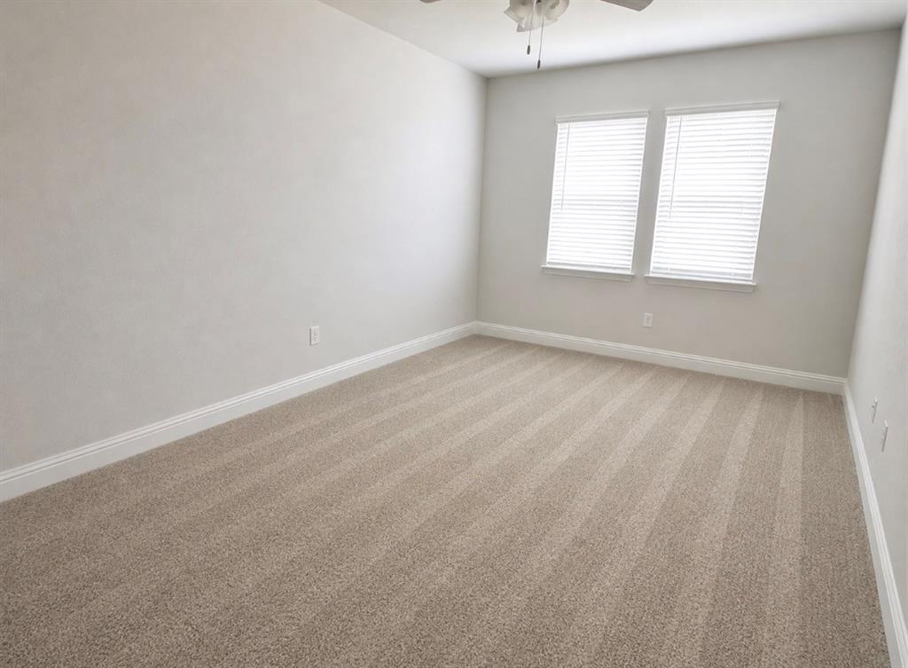 7849 Sunset Boulevard Rowlett, TX 75088 - Photo 7 of 13 an empty room with a window
