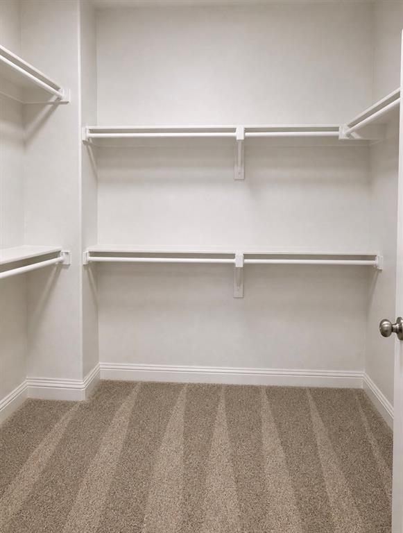7849 Sunset Boulevard Rowlett, TX 75088 - Photo 9 of 13 a view of an empty walk in closet