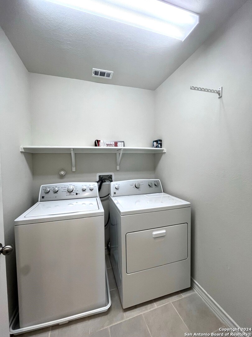 13210 Desana Springs St. Hedwig, TX 78152 - Photo 14 of 16 a utility room with dryer and washer