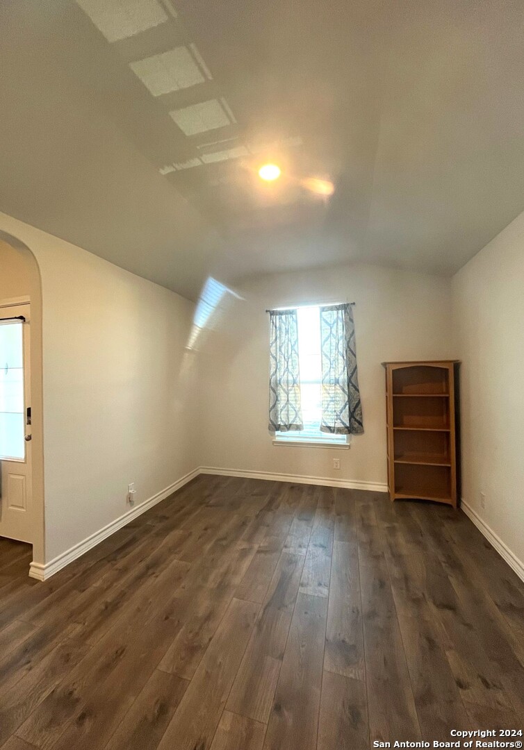 13210 Desana Springs St. Hedwig, TX 78152 - Photo 2 of 16 an empty room with wooden floor and windows