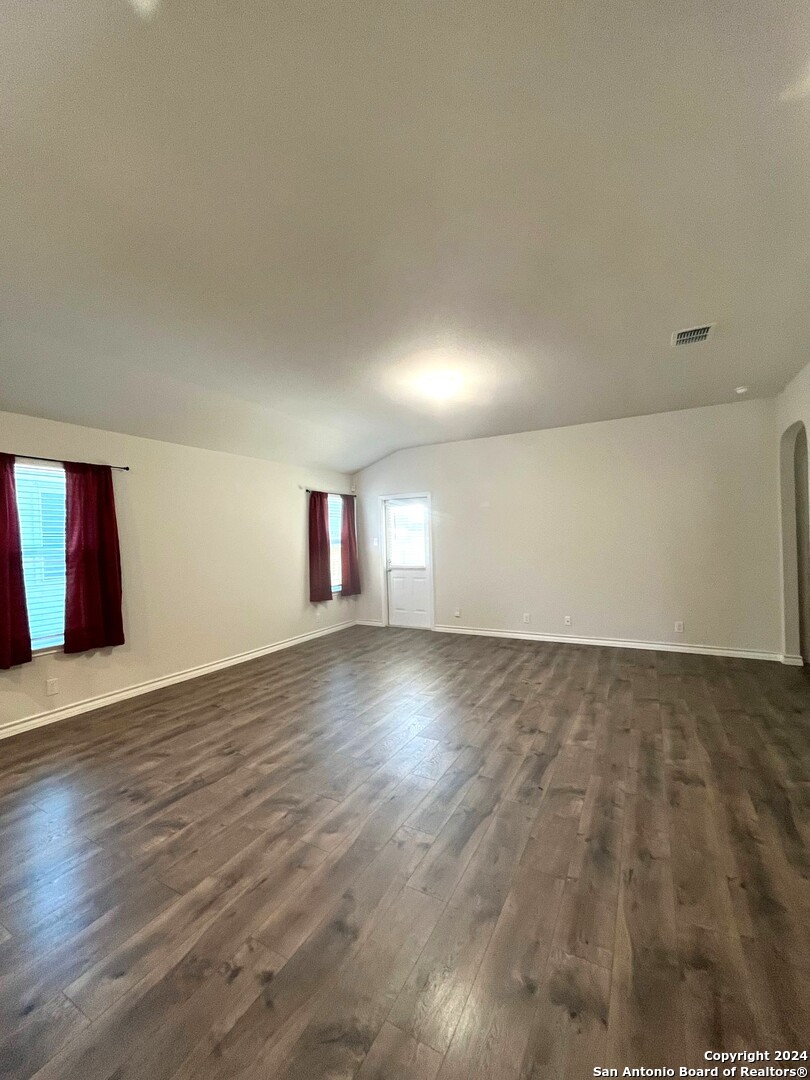 13210 Desana Springs St. Hedwig, TX 78152 - Photo 5 of 16 a view of empty room with wooden floor