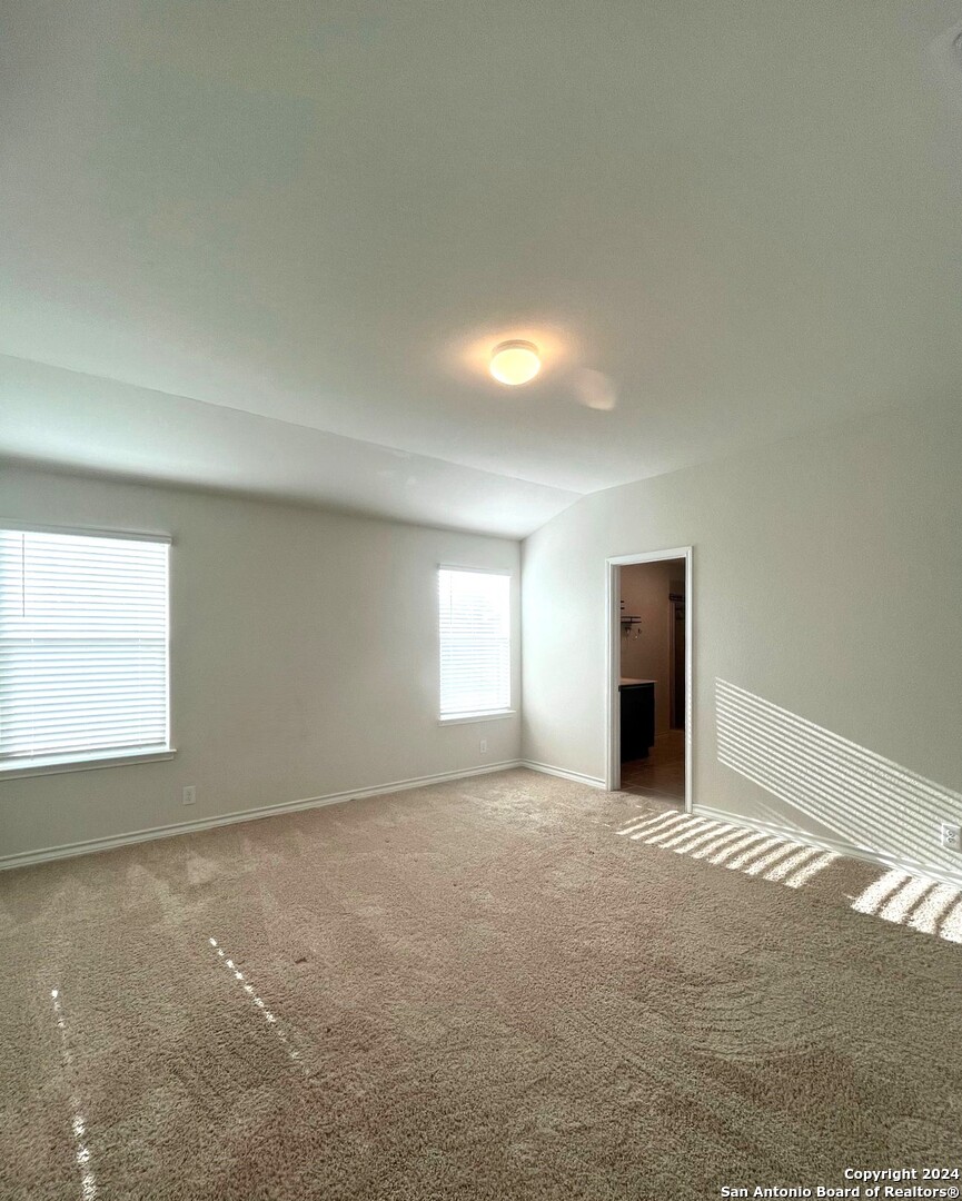 13210 Desana Springs St. Hedwig, TX 78152 - Photo 6 of 16 an empty room with windows and entrance