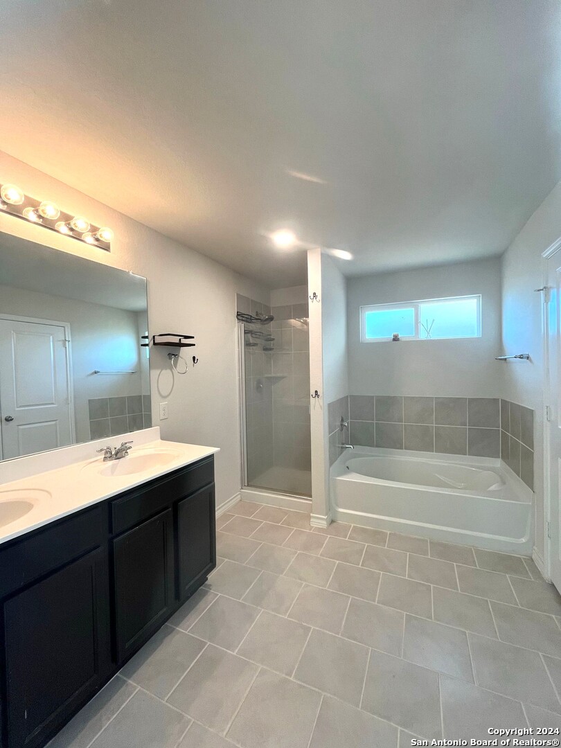 13210 Desana Springs St. Hedwig, TX 78152 - Photo 8 of 16 a bathroom with a bathtub and a sink