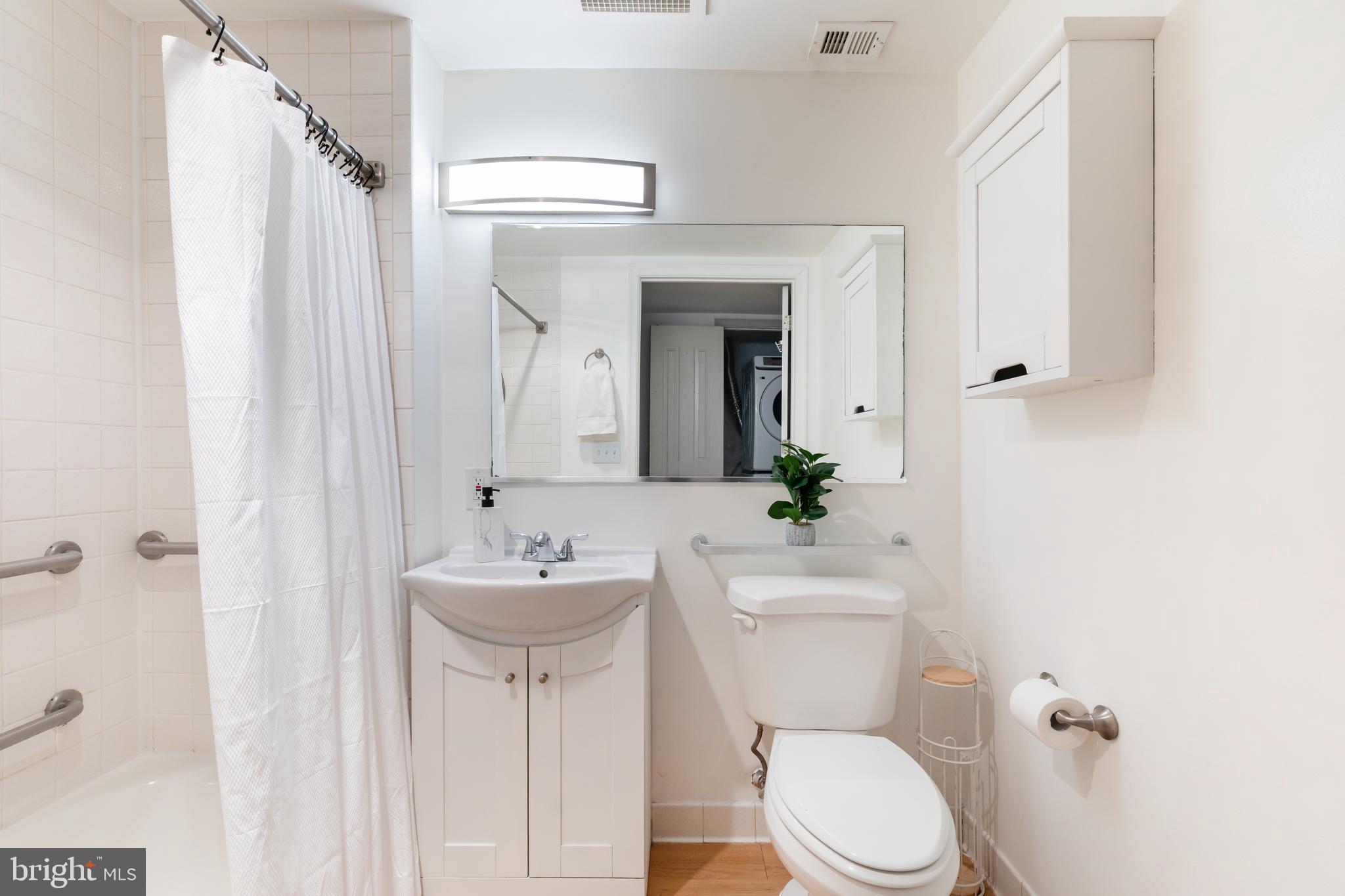 20 Logan Circle Northwest, Unit LL3 Washington, DC 20005 - Photo 11 of 15 Full bath with neutral finishes.