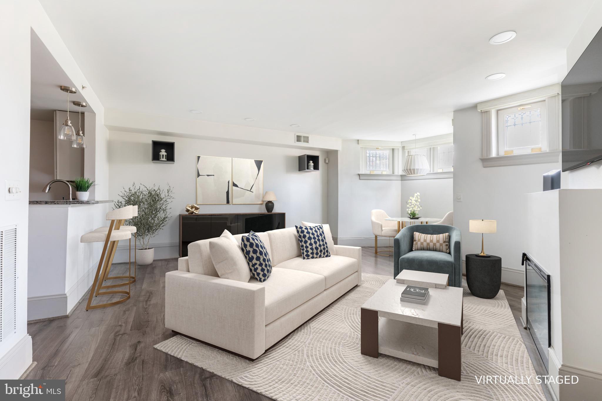 20 Logan Circle Northwest, Unit LL3 Washington, DC 20005 - Photo 4 of 15 Living area with fireplace (VS)