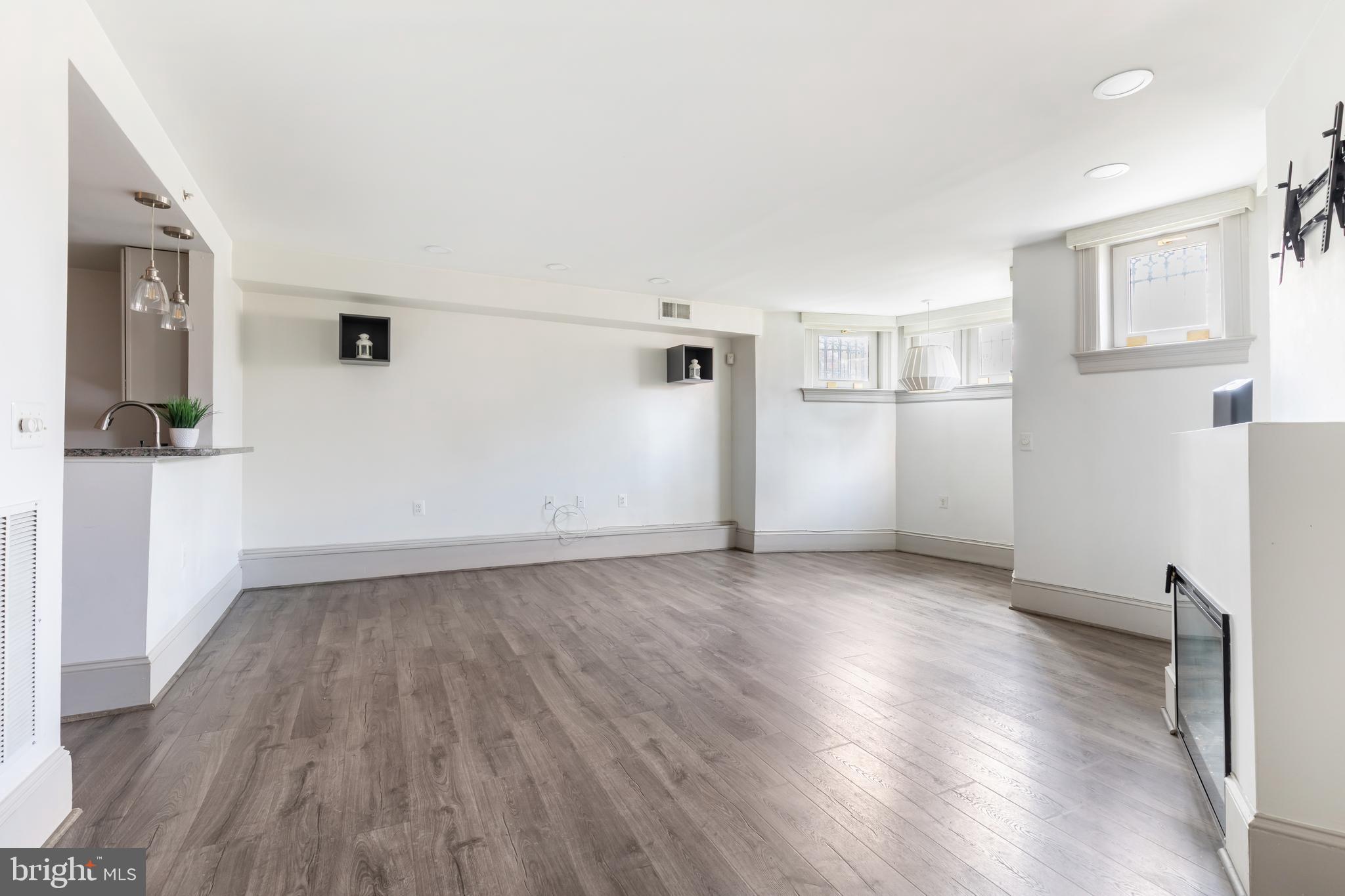 20 Logan Circle Northwest, Unit LL3 Washington, DC 20005 - Photo 5 of 15 Open living space with wide-plank flooring