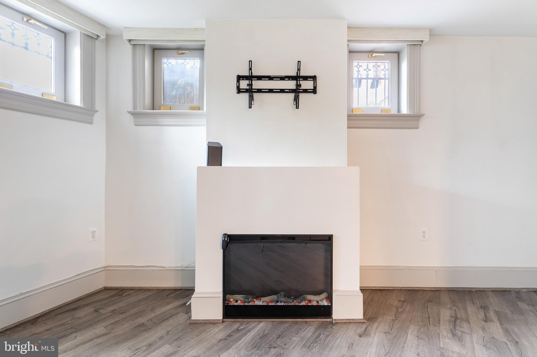 20 Logan Circle Northwest, Unit LL3 Washington, DC 20005 - Photo 6 of 15 Sleek fireplace creating warmth and character.