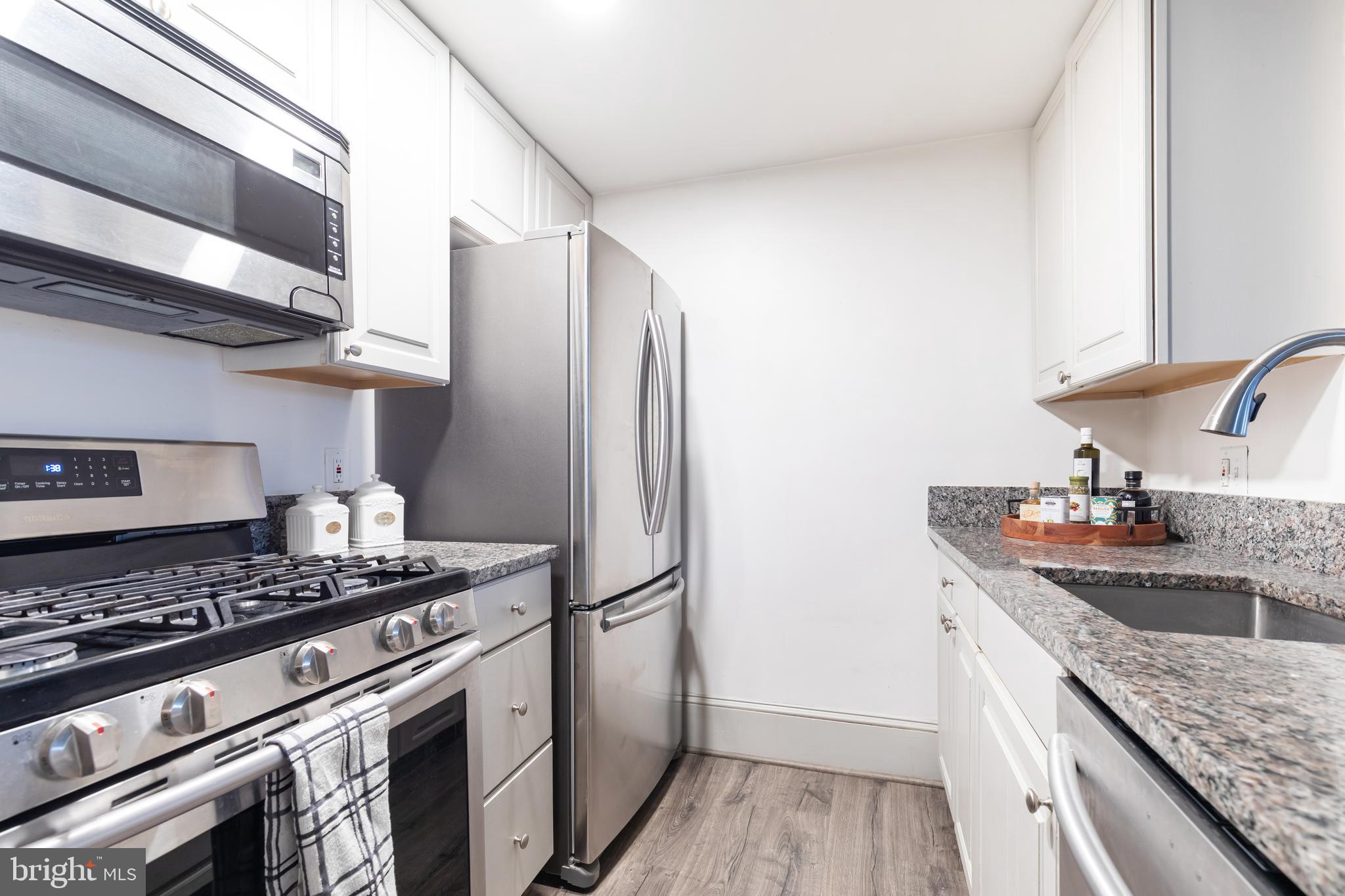 20 Logan Circle Northwest, Unit LL3 Washington, DC 20005 - Photo 9 of 15 Granite countertops and stainless appliances.