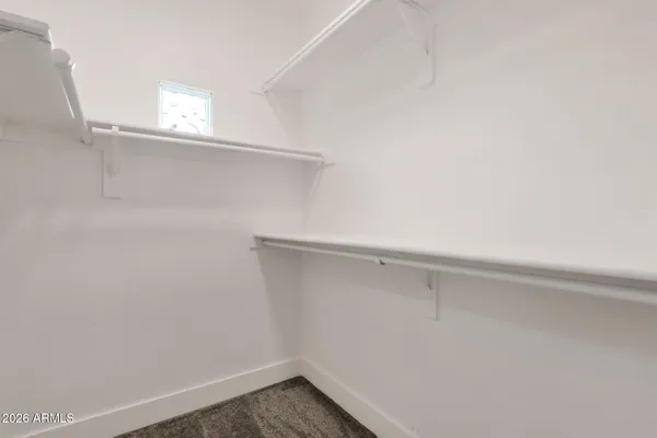 a bathroom with a granite countertop sink toilet a mirror and shower